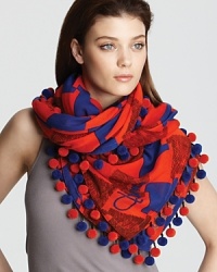 Make a statement with this cozy scarf featuring a colorful weave of red and blue abstract check and matching ball trim. Make a statement with this cozy scarf featuring a colorful weave of red and blue abstract check and matching ball trim.