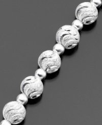 This distinctive bracelet features beautifully swirled beads (6 mm) of luminous diamond-cut sterling silver by Giani Bernini. Approximate length: 7-1/2 inches. This distinctive bracelet features beautifully swirled beads (6 mm) of luminous diamond-cut sterling silver by Giani Bernini. Approximate length: 7-1/2 inches.