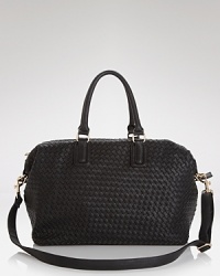 A tried-and-true travel bag with a textured twist. Crafted from woven PVC, this Cornelia Guest weekender is ready to carry on. A tried-and-true travel bag with a textured twist. Crafted from woven PVC, this Cornelia Guest weekender is ready to carry on.