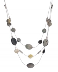 Decorate your neckline with this chic, contemporary style. Kenneth Cole New York's seashore-inspired necklace features three rows of shimmery shells. Set in silver tone mixed metal. Approximate length: 19 inches + 3-inch extender. Approximate drop: 2-1/4 inches. Decorate your neckline with this chic, contemporary style. Kenneth Cole New York's seashore-inspired necklace features three rows of shimmery shells. Set in silver tone mixed metal. Approximate length: 19 inches + 3-inch extender. Approximate drop: 2-1/4 inches.