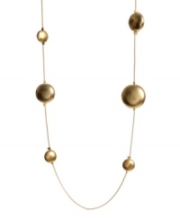 Add a long layer of rich, golden bubbles to your neckline in this light and airy necklace. Crafted in worn gold tone mixed metal; by Kenneth Cole New York. Approximate length: 36 inches. Add a long layer of rich, golden bubbles to your neckline in this light and airy necklace. Crafted in worn gold tone mixed metal; by Kenneth Cole New York. Approximate length: 36 inches.