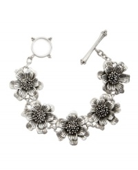 Channel your best flower child style with this pretty bracelet by Lucky Brand. Boasting an intricate Thai flower design, bracelet crafted in silver tone mixed metal with toggle closure. Approximate length: 7-5/8 inches. Channel your best flower child style with this pretty bracelet by Lucky Brand. Boasting an intricate Thai flower design, bracelet crafted in silver tone mixed metal with toggle closure. Approximate length: 7-5/8 inches.