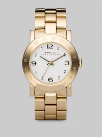Ionic plated case and bracelet with a polished finish and clear stone hour markers.Quartz movement Water resistant to 3 ATM IP (ionic plated) gold bezel with engraved logo Round case, 36mm, (1.43) White dial IP gold numeral and clear stone hour makers Second hand IP gold stainless steel bracelet, 20mm, (.79) Imported Ionic plated case and bracelet with a polished finish and clear stone hour markers.Quartz movement Water resistant to 3 ATM IP (ionic plated) gold bezel with engraved logo Round case, 36mm, (1.43) White dial IP gold numeral and clear stone hour makers Second hand IP gold stainless steel bracelet, 20mm, (.79) Imported