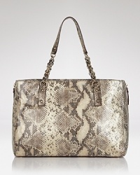 This poised kate spade new york shoulder bag is updated in embossed leather with glinting trims. A simple snap closure opens to 3 interior pockets to accommodate essentials. This poised kate spade new york shoulder bag is updated in embossed leather with glinting trims. A simple snap closure opens to 3 interior pockets to accommodate essentials.