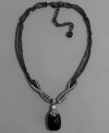 Satisfy your style cravings with this delectable necklace by Givenchy. A jet black pendant is highlighted with crystal accents set in hematite-plated mixed metal. Approximate length: 10 inches + 3-inch extender. Approximate drop: 3 inches.