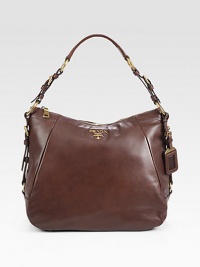 Calfskin in a slouchy top handle carryall.Top handle, 7½ dropTop-zip closureMetal lettering logoBronze hardwareProtective metal feetOne inside zip pocketOne inside open pocketPrada logo lining12½W X 11H X 5½DMade in Italy Calfskin in a slouchy top handle carryall.Top handle, 7½ dropTop-zip closureMetal lettering logoBronze hardwareProtective metal feetOne inside zip pocketOne inside open pocketPrada logo lining12½W X 11H X 5½DMade in Italy