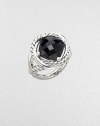 From the Infinity Collection. A deep, dramatic faceted stone of black onyx in a setting formed of intertwining smooth bands and cables of sterling silver.Black onyxSterling silverDiameter, about ½Imported