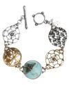 Easy, breezy, effortless style. Lucky Brand's delicate toggle bracelet features open-work floral links and a reconstituted turquoise stone with a butterfly accent. Setting and toggle clasp crafted in silver and gold tone mixed metal. Approximate length: 7-3/4 inches.