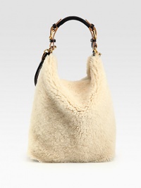 Super-soft and luxurious shearling design with a detachable drawstring lining and a roomy interior for all your essentials.Leather top handle, 6 dropLeather shoulder strap, 13½ dropDrawstring closureDetachable lining10½W X 14½H X 5DMade in Italy Super-soft and luxurious shearling design with a detachable drawstring lining and a roomy interior for all your essentials.Leather top handle, 6 dropLeather shoulder strap, 13½ dropDrawstring closureDetachable lining10½W X 14½H X 5DMade in Italy
