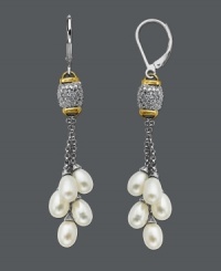 Elaborate elegance at its finest. Perfect for day or night wear, earrings feature delicate cultured freshwater pearl drops (5 mm x 7 mm), sparkling round-cut diamonds (1/8 ct. t.w.) and a sterling silver and 14k gold setting. Approximate drop: 2-1/3 inches. Elaborate elegance at its finest. Perfect for day or night wear, earrings feature delicate cultured freshwater pearl drops (5 mm x 7 mm), sparkling round-cut diamonds (1/8 ct. t.w.) and a sterling silver and 14k gold setting. Approximate drop: 2-1/3 inches.