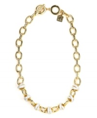A modern link to classic style. This AK Anne Klein necklace boasts knot detail with ivory enamel. Crafted in gold tone mixed metal. Approximate length: 17 inches + 2-inch extender A modern link to classic style. This AK Anne Klein necklace boasts knot detail with ivory enamel. Crafted in gold tone mixed metal. Approximate length: 17 inches + 2-inch extender