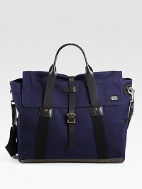 Tote all your essentials in this handsome carryall with adjustable shoulder strap, double top handles and leather trim.Double top handlesFlap with buckle closuresAdjustable shoulder strapExterior side pocketsInterior zip pocketCotton ripstop with leather trim13W X 16½H X 6DImported Tote all your essentials in this handsome carryall with adjustable shoulder strap, double top handles and leather trim.Double top handlesFlap with buckle closuresAdjustable shoulder strapExterior side pocketsInterior zip pocketCotton ripstop with leather trim13W X 16½H X 6DImported