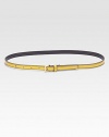 Polished leather with goldtone metal buckle. Width, about .5Made in Italy