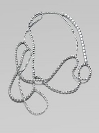 A versatile piece that features tonal strands of beads in an artfully asymmetrical style. Glass and acrylic beadsLength, about 52Slip-on styleImported 