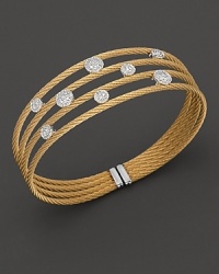 From the Classique collection, a white gold and yellow PVD cable cuff with round diamond stations. Designed by Charriol. From the Classique collection, a white gold and yellow PVD cable cuff with round diamond stations. Designed by Charriol.