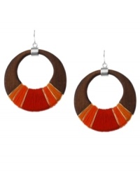 Thread together your perfect look. Kenneth Cole New York's chic style meshes a brown wood hoop setting wrapped in red and orange thread and silver tone wire. Approximate diameter: 2-3/4 inches. Thread together your perfect look. Kenneth Cole New York's chic style meshes a brown wood hoop setting wrapped in red and orange thread and silver tone wire. Approximate diameter: 2-3/4 inches.