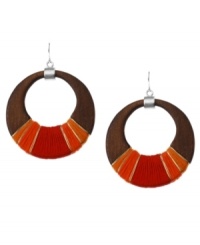 Thread together your perfect look. Kenneth Cole New York's chic style meshes a brown wood hoop setting wrapped in red and orange thread and silver tone wire. Approximate diameter: 2-3/4 inches.