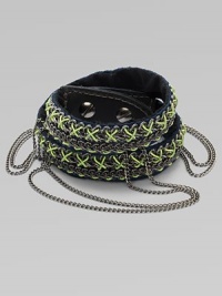 An edgy, street-smart design with oxidized links brightly stitched onto a double-wrap leather cuff with draped chains and a bold stud closure.LeatherGoldtoneCotton backingLength, about 16½Width, about 3Stud snap closureImported An edgy, street-smart design with oxidized links brightly stitched onto a double-wrap leather cuff with draped chains and a bold stud closure.LeatherGoldtoneCotton backingLength, about 16½Width, about 3Stud snap closureImported
