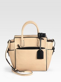 Supple, brushed, glove tanned leather with a contrasting trim and removable zipper pouch.Double top handles, 4 dropDetachable adjustable shoulder strap, 21-22½ dropTop zip closureThree outside open pocketsOne detachable zip pouchOne inside zip pocketTwo inside open pocketsCotton lining9W X 10½H X 3½DImported Supple, brushed, glove tanned leather with a contrasting trim and removable zipper pouch.Double top handles, 4 dropDetachable adjustable shoulder strap, 21-22½ dropTop zip closureThree outside open pocketsOne detachable zip pouchOne inside zip pocketTwo inside open pocketsCotton lining9W X 10½H X 3½DImported