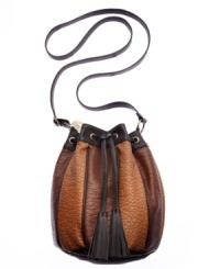 Get drawn in with this colorblock crossbody from American Rag that gives a new meaning to casual cool. With flirty tassels, unique shape and neutral tones, it's ideal for any easygoing look. Get drawn in with this colorblock crossbody from American Rag that gives a new meaning to casual cool. With flirty tassels, unique shape and neutral tones, it's ideal for any easygoing look.
