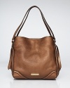 The compact handbag is this season's trend story, and this leather Burberry style refines the look. Its slightly structured silhouette is secured by a snap, which opens to a fully lined interior with 3 pockets.