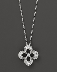 Diamonds set in a 14K. white gold flower pendant. Diamonds set in a 14K. white gold flower pendant.