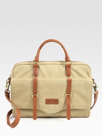 Both trim and roomy, in rugged leather-trimmed canvas, perfectly sized to protect your computer and hold a few other essentials as well.Double top handlesDetachable padded shoulder strapTop zip closeOutside buckle-strap flap pocketInside computer compartment and zip pocketCotton lining15W X 10H X 2DImported Both trim and roomy, in rugged leather-trimmed canvas, perfectly sized to protect your computer and hold a few other essentials as well.Double top handlesDetachable padded shoulder strapTop zip closeOutside buckle-strap flap pocketInside computer compartment and zip pocketCotton lining15W X 10H X 2DImported