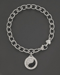Sparkling sapphires form a brilliant yin yang, set in sterling silver. By Judith Ripka. Sparkling sapphires form a brilliant yin yang, set in sterling silver. By Judith Ripka.