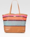 A roomy carryall with a brightly colored woven pattern in luxurious leather.Double shoulder strap, 10 dropOpen topProtective metal feetThree inner compartmentsOne inside zip pocketTwo inside open pocketsCotton lining18¼W X 13H X 6½DImported