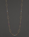 Faceted oval amethyst and blue topaz add rich sparkle to 14K yellow gold. By Nancy B.