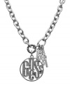 Get shimmering GUESS style with this chic pendant necklace. Features a glittering logo charm with crystal accents and 1981 numerals. Setting crafted in imitation rhodium-plated mixed metal. Approximate length: 16 inches + 2-inch extender. Approximate drop: 1-1/2 inches.