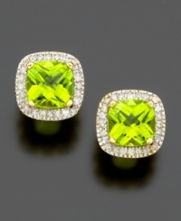 The fun and fresh color of cushion-cut peridot (2-5/8 ct. t.w.) shines brightly within a border of sparkling round-cut diamonds (1/4 ct. t.w.). Set in 14k gold. The fun and fresh color of cushion-cut peridot (2-5/8 ct. t.w.) shines brightly within a border of sparkling round-cut diamonds (1/4 ct. t.w.). Set in 14k gold.