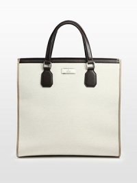 Canvas tote with leather trim.Double handlesDark palladium hardwareInterior zip, cell phone and PDA pocketCotton/linen lining17W x 16H x 7D Made in Italy Canvas tote with leather trim.Double handlesDark palladium hardwareInterior zip, cell phone and PDA pocketCotton/linen lining17W x 16H x 7D Made in Italy