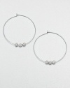 From the Brilliance Collection. A slender wire hoop, adorned with three sparkling beads, creates a look of understated glamour.GlassSilvertoneDiameter, about 1.25PiercedImported