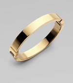 A thin goldtone design with hinge closure, perfect for stacking. Goldtone steelDiameter, about 2¾Hinged closureImported 