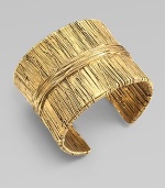 Richly textured with an organic look, this golden cuff has the sculptural appearance of wrapped and tied threads.GoldplatedDiameter, about 2¼Width, about 2Made in France