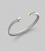 From the Cable Classics Collection. A signature Yurman cable of sterling silver, richly enhanced by white freshwater pearl end caps banded in 14k gold. White freshwater pearls Sterling silver and 14k yellow gold Cable, 5mm Diameter, about 2¼ Imported