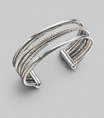 From the Silver Ice Crossover Collection. Crisscross rows of sterling silver and white gold - some smooth, some twisted, some paved with diamonds - create a shining look in this open strand cuff. Diamonds, 0.75 tcw Sterling silver & 14k white gold Cable, 3mm Diameter, about 2½ Width, about ¾ Made in USA