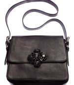 Luxe and lovely, this diva-licious design from Juicy Couture gives any outfit an uptown look. Supple leather is accented with an eye-catching stone accent, while plenty of interior compartments organize your essentials with ease.