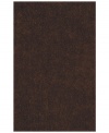 Add rich, shimmering chocolate tones to any modern room with the Metallic area rug from Dalyn. Hand-tufted of soft polyester, this high-luster shag area rug puts comfort and fun back in floor decor.