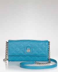 This Marc Jacobs crossbody works a classic silhouette in luxurious quilted leather. A fusion of beauty and function, its snap flap opens to a lined interior with a zip pocket and sixteen card slots. This Marc Jacobs crossbody works a classic silhouette in luxurious quilted leather. A fusion of beauty and function, its snap flap opens to a lined interior with a zip pocket and sixteen card slots.