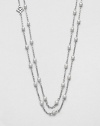 From the Pearl Collection. A graceful chain is delightfully dotted with creamy white pearls in this lovely strand that's long enough to douoble or even knot.3.5mm round white pearlsSterling silverLength, about 60Toggle closureImported