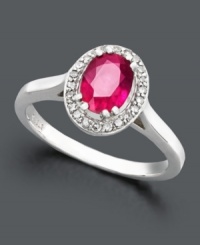 Regal design in vivid colors. This royalty-inspired ring features an oval-cut ruby (9/10 ct. t.w.) surrounded by sparkling diamonds (1/10 ct. t.w.). Band and setting crafted in sterling silver. Regal design in vivid colors. This royalty-inspired ring features an oval-cut ruby (9/10 ct. t.w.) surrounded by sparkling diamonds (1/10 ct. t.w.). Band and setting crafted in sterling silver.