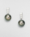 Three dazzling, graduated diamonds set in 18k white gold accent this rich Tahitian pearl drop design. 9mm round Tahitian pearlsDiamonds, .48 tcw18k white goldDrop, about .75Post backImported 