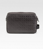 An essential travel companion constructed for a lifetime of use in fine, gancio-embossed leather. Zip closure Side handle 9¾W X 6¾H X 3D Made in Italy 