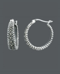 Let your style do all the talking. These Genevieve & Grace earrings express elegance and sophistication with glittering marcasite accents and intricate rope edging. Crafted in sterling silver. Approximate diameter: 7/8 inch. Let your style do all the talking. These Genevieve & Grace earrings express elegance and sophistication with glittering marcasite accents and intricate rope edging. Crafted in sterling silver. Approximate diameter: 7/8 inch.