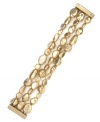 Golden goddess. Three rows of nugget-shaped bead accents adorn Jones New York's golden stretch bracelet. Set in worn gold tone mixed metal. Approximate diameter: 2-1/4 inches.