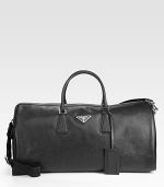 Textured saffiano leather duffel with tessuto nylon lining.Double top handlesAdjustable shoulder strapsZip closureFully lined21W x 10¼H x 9DMade in Italy