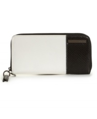 A sleek design with just the right amount of edge. This eye-catching wallet by Kenneth Cole Reaction features subtle python print accents, a signature plaque at front and shiny silvertone hardware. A sleek design with just the right amount of edge. This eye-catching wallet by Kenneth Cole Reaction features subtle python print accents, a signature plaque at front and shiny silvertone hardware.