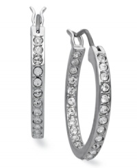 Classic elegance, inside and out. These hoop earrings from Swarovski illuminate all occasions with clear crystal pave. Crafted in rhodium-plated mixed metal. Approximate diameter: 3/4 inch. Classic elegance, inside and out. These hoop earrings from Swarovski illuminate all occasions with clear crystal pave. Crafted in rhodium-plated mixed metal. Approximate diameter: 3/4 inch.